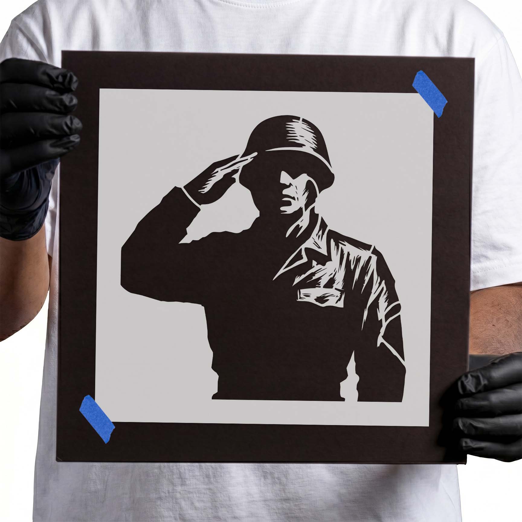 Saluting soldier silhouette stencil wearing military helmet
