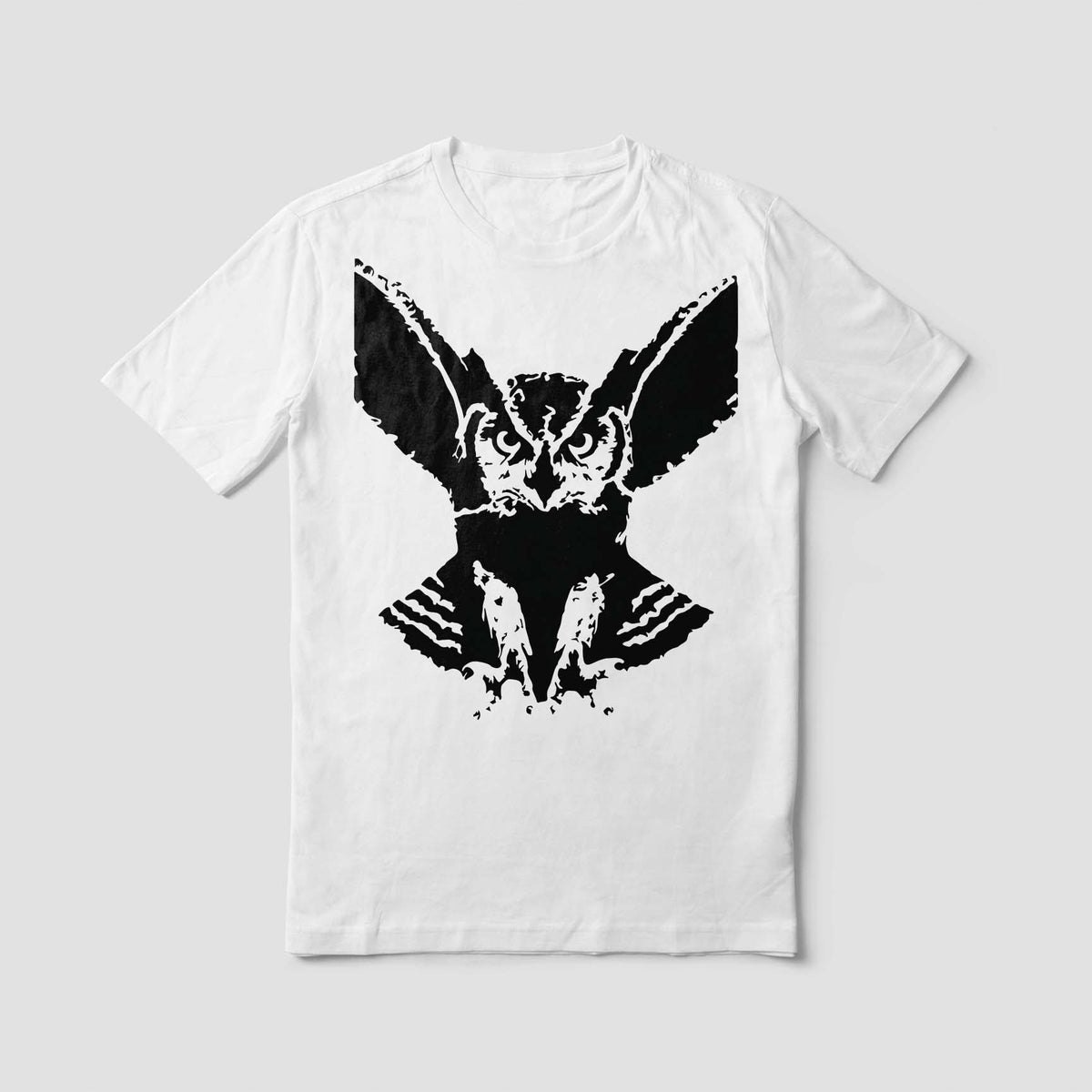 Bold Sinister Owl Stencil features an intense flying owl graphic on a white shirt