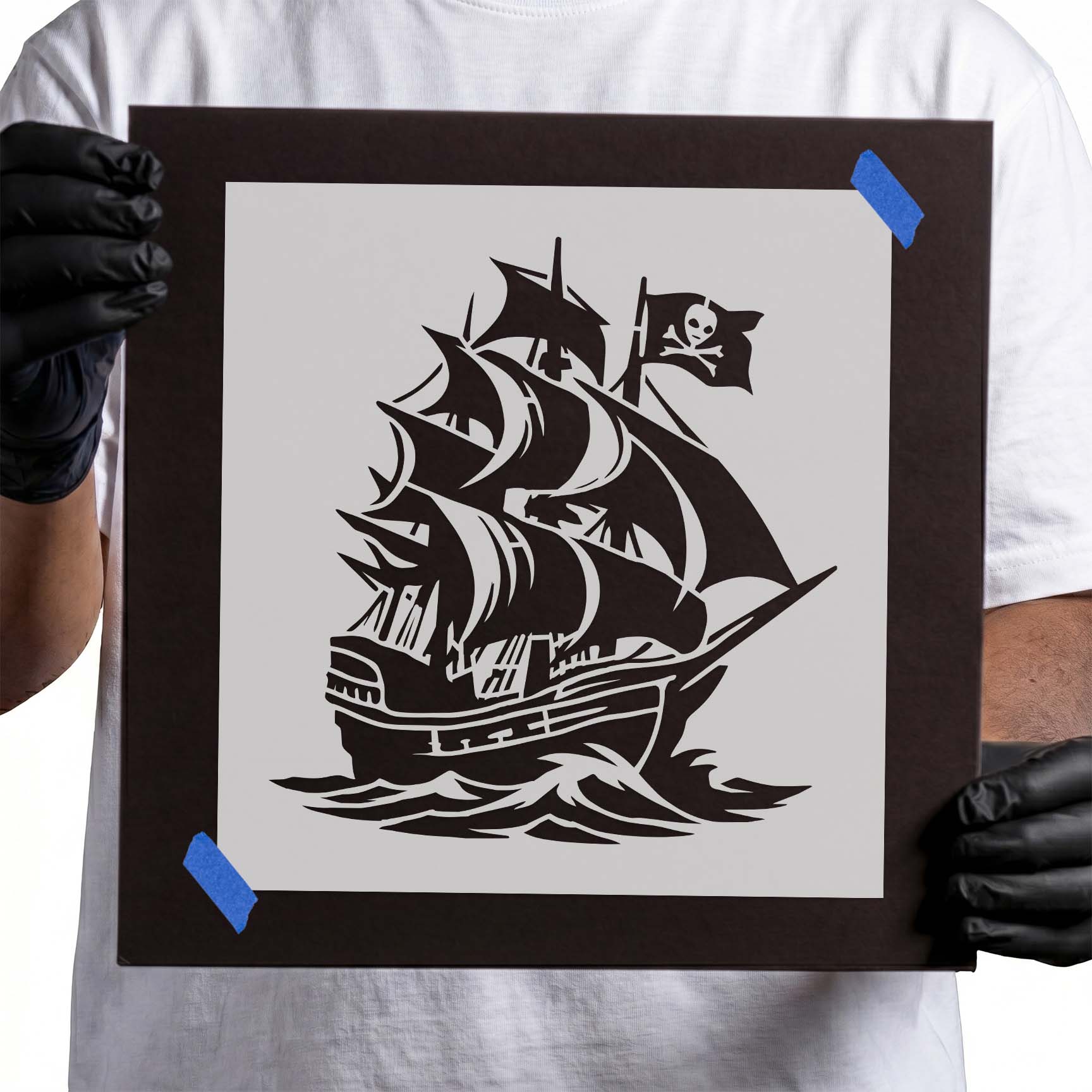 Pirate ship stencil with skull flag, full sails, and ocean waves