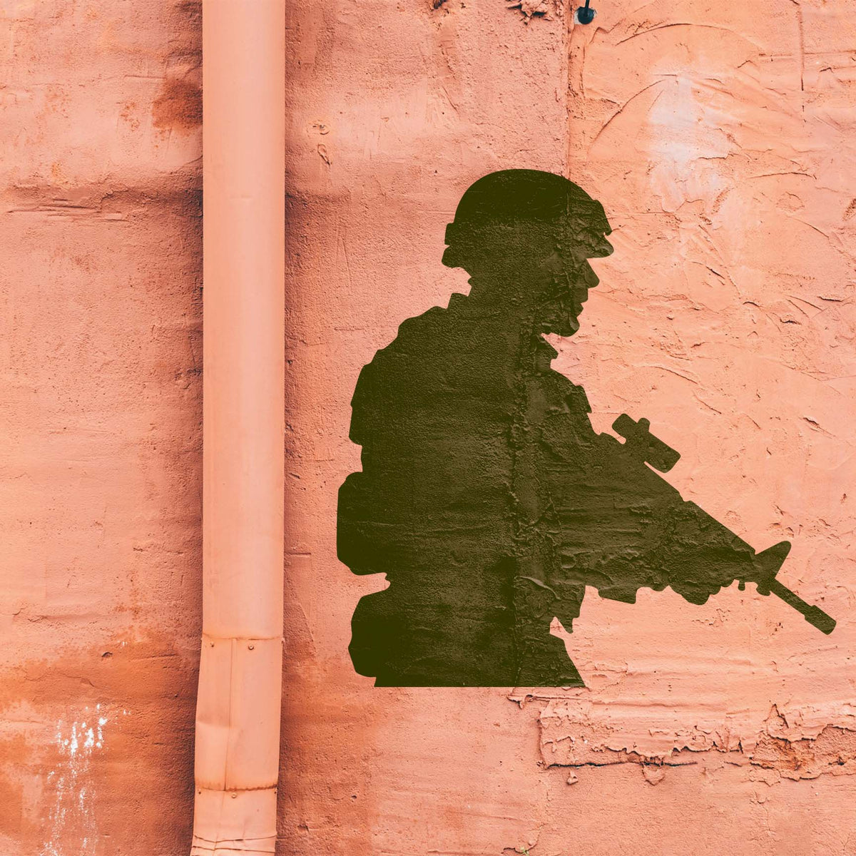 Tactical Soldier Silhouette Stencil displayed on a textured salmon wall