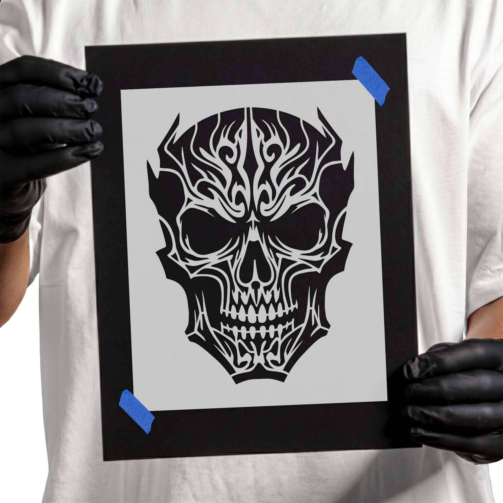 Tribal gothic skull stencil with intricate ornamental linework
