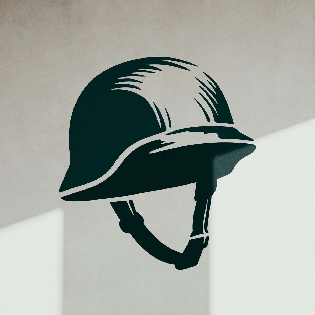 WWII Style Helmet Stencil displayed on a light wall with dramatic natural shadows