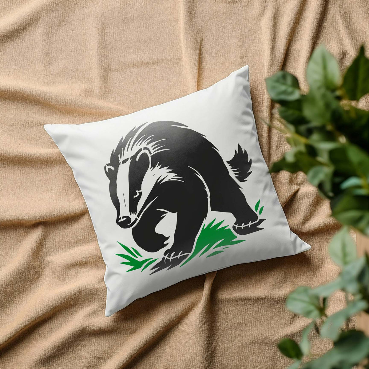 Walking badger stencil printed in black and green on white pillow