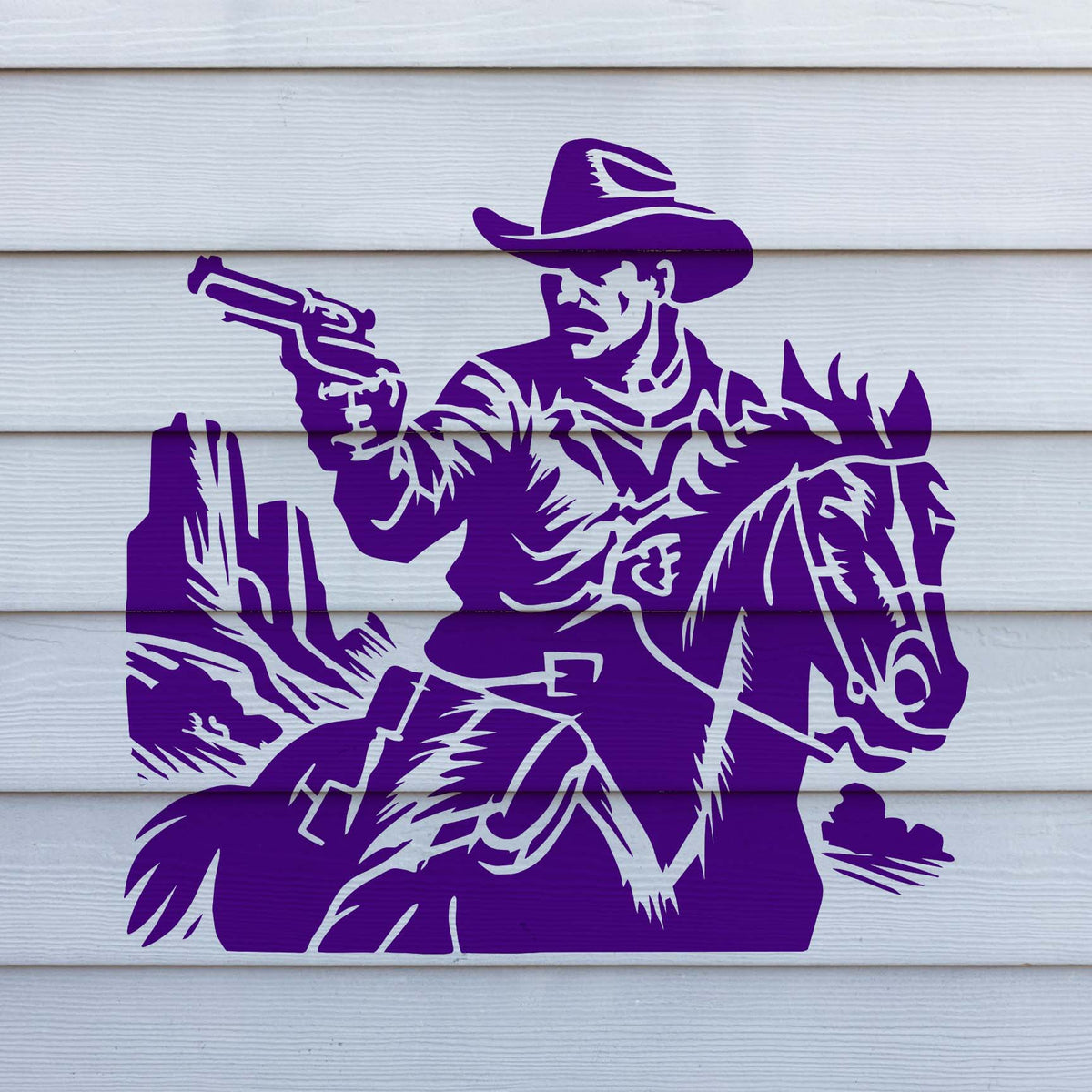The Wild West Gunslinger Stencil stands out in vivid purple on white siding with a cowboy and horse design.