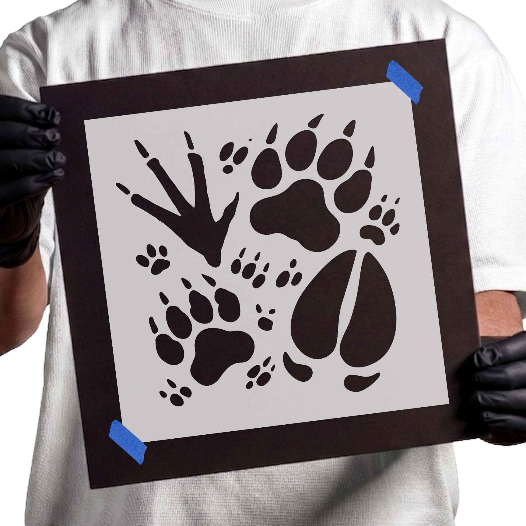 Wildlife animal tracks stencil with bear paw, bird, hoof, and small footprints
