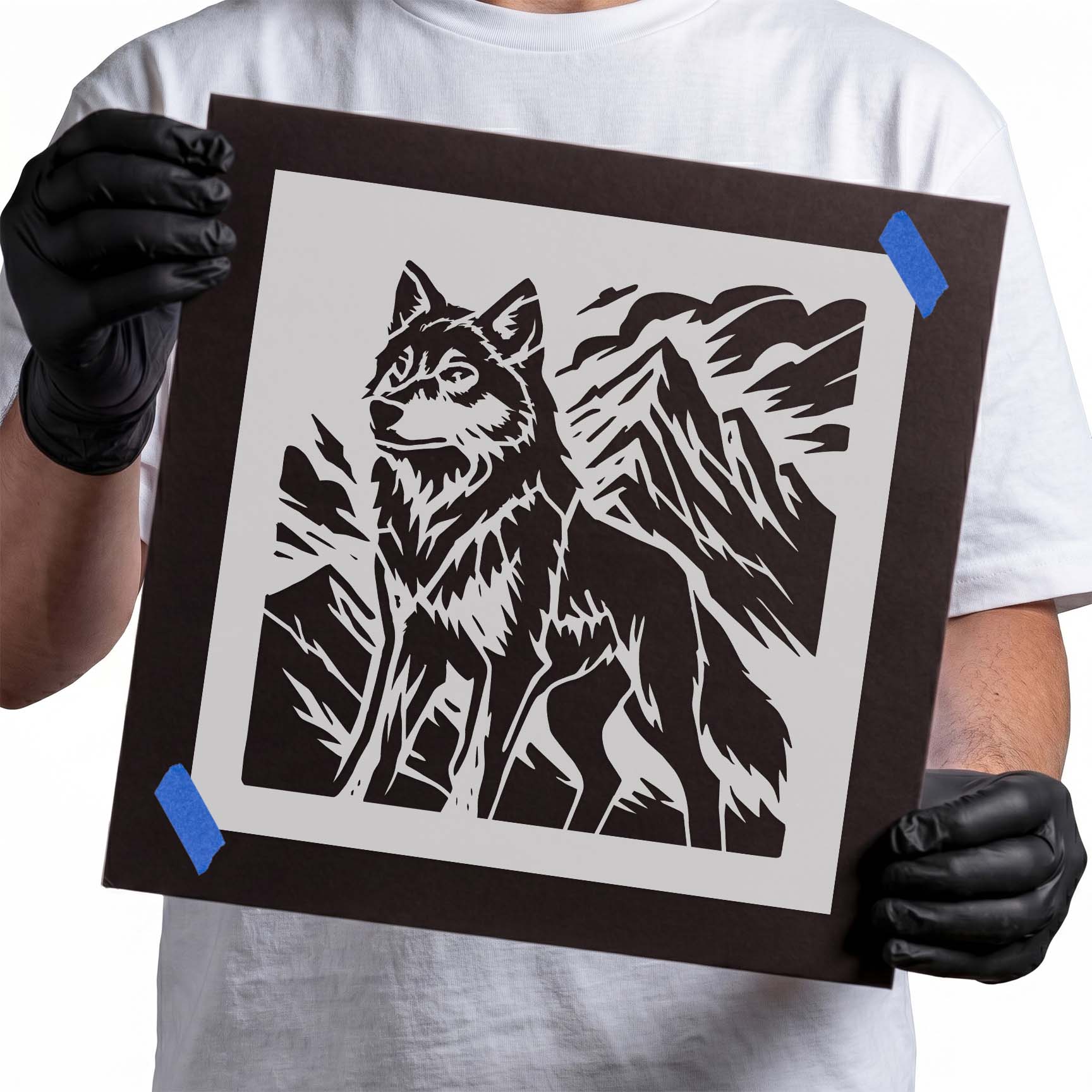 Wolf standing before rugged mountain peaks stencil design