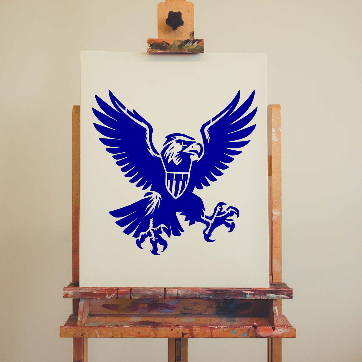 Blue American Eagle Crest Stencil takes flight across a white canvas, featuring spread wings and sharp talons.