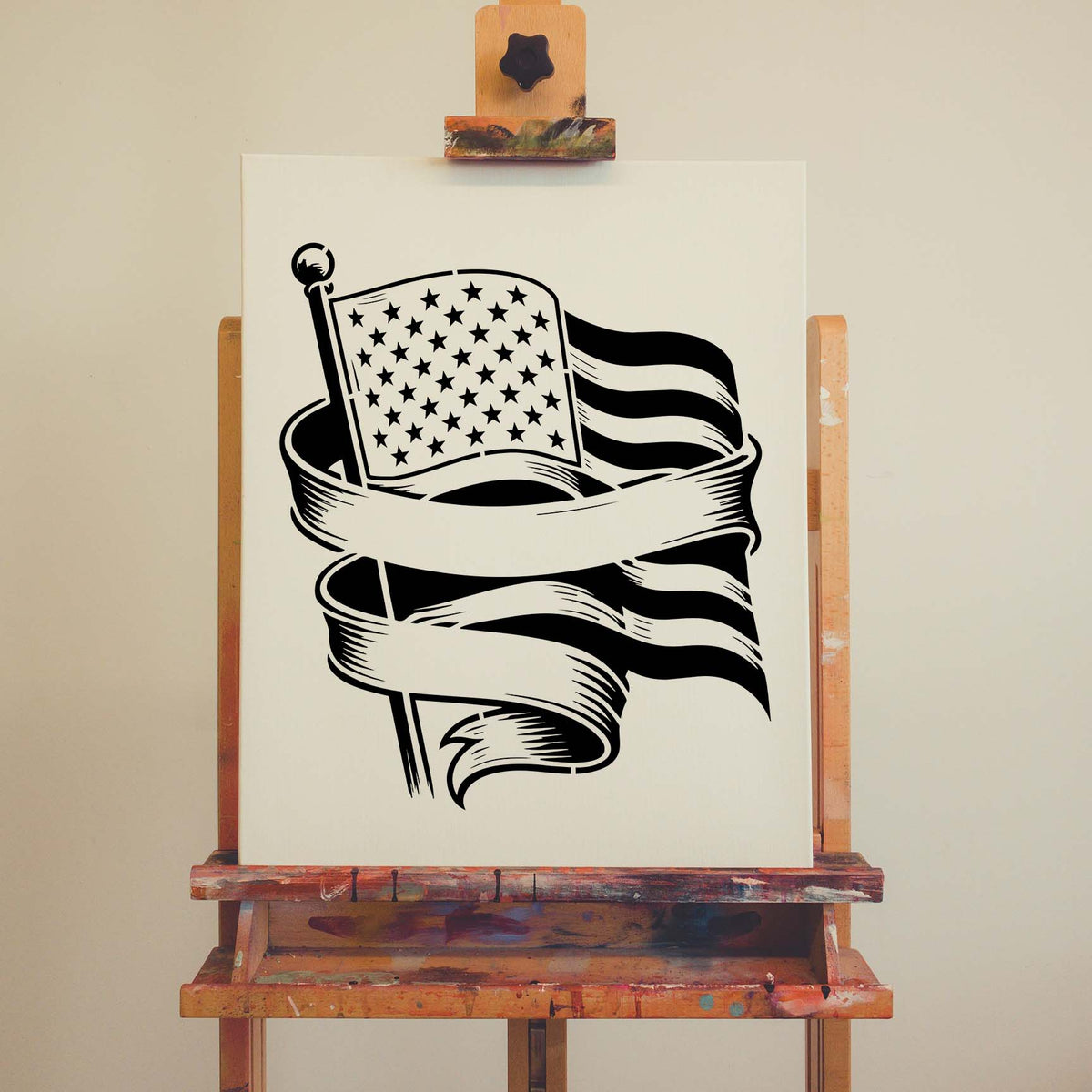 On an artist canvas, the American Flag Banner Stencil pairs a waving flag with sweeping ribbons