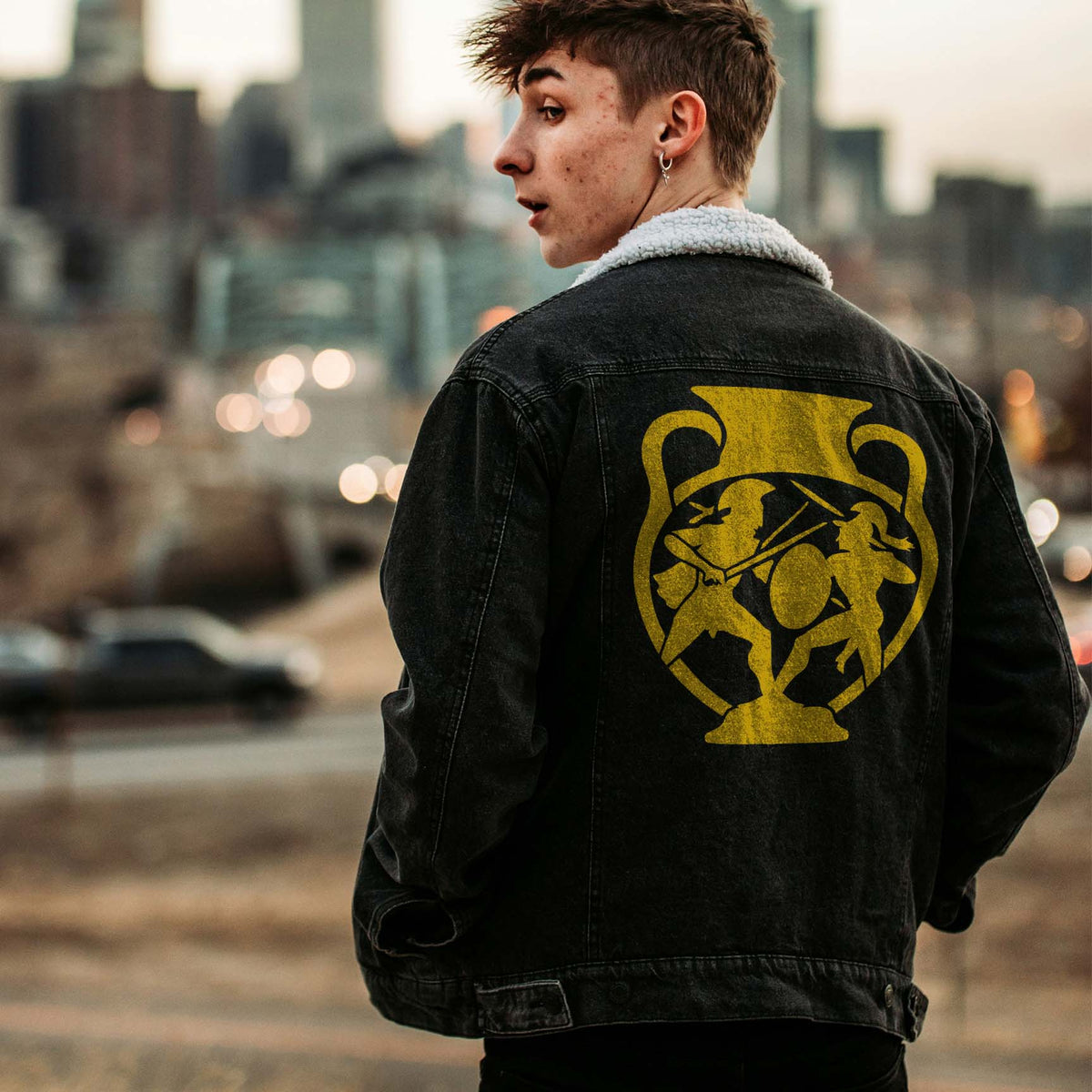 Ancient Greek Warriors Vase Stencil painted yellow on the back of a black denim jacket.