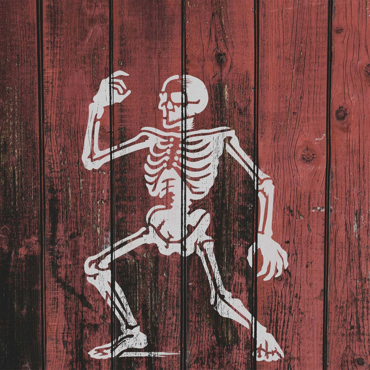 Animated Dancing Skeleton Stencil dances across rustic red wood planks in a weathered white finish