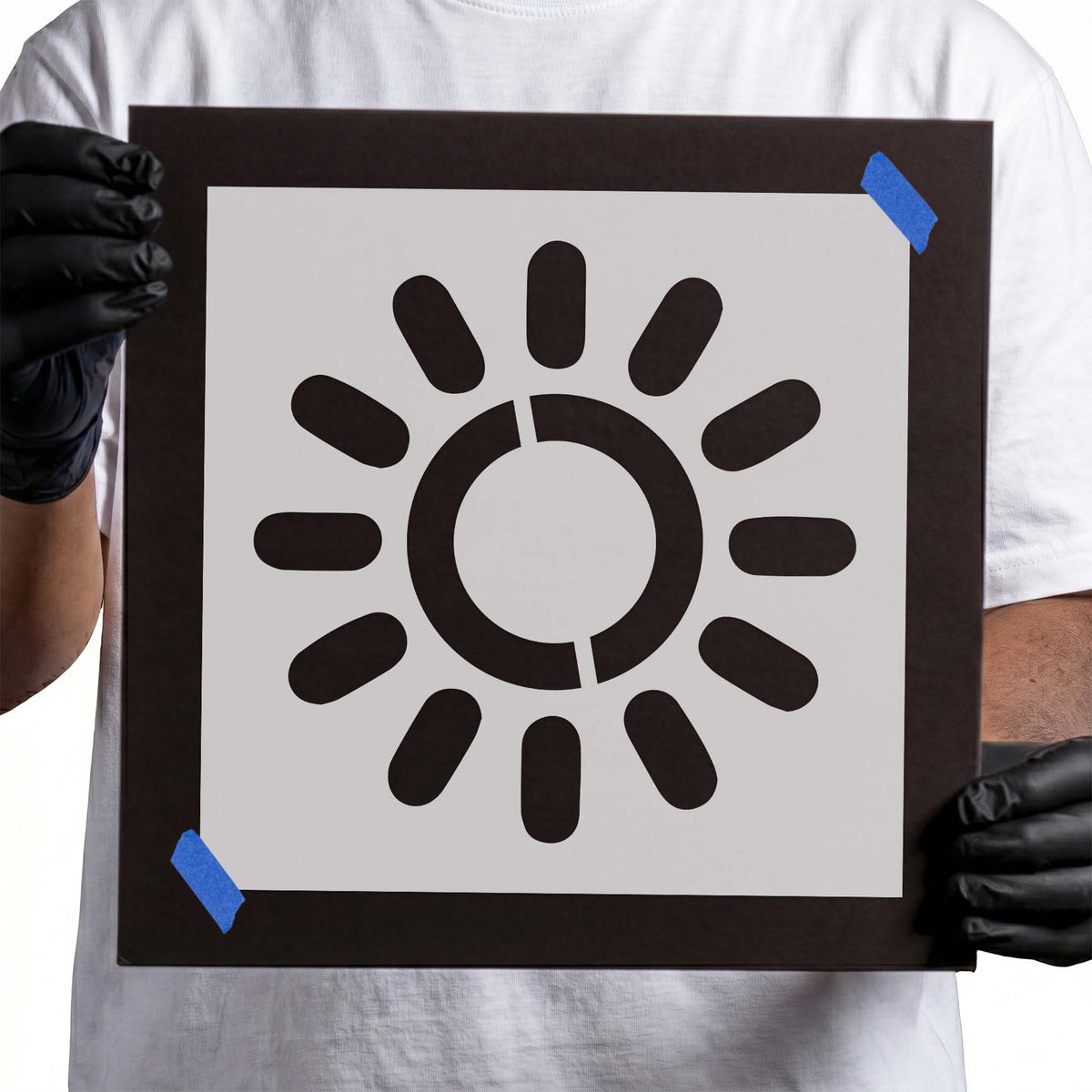 Sun stencil with circular center and evenly spaced rounded rays