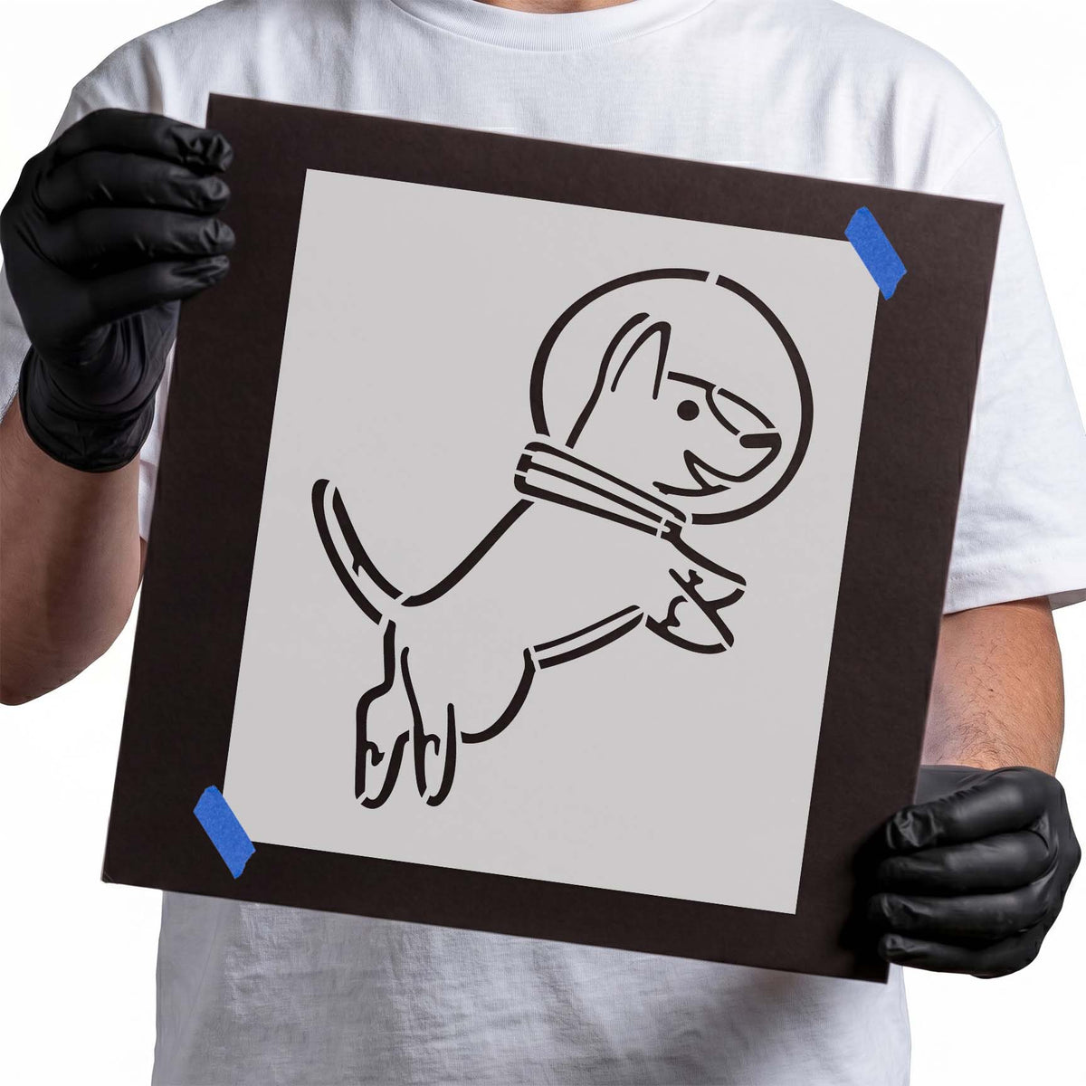 Playful astronaut dog stencil showing a leaping pup wearing a round space helmet