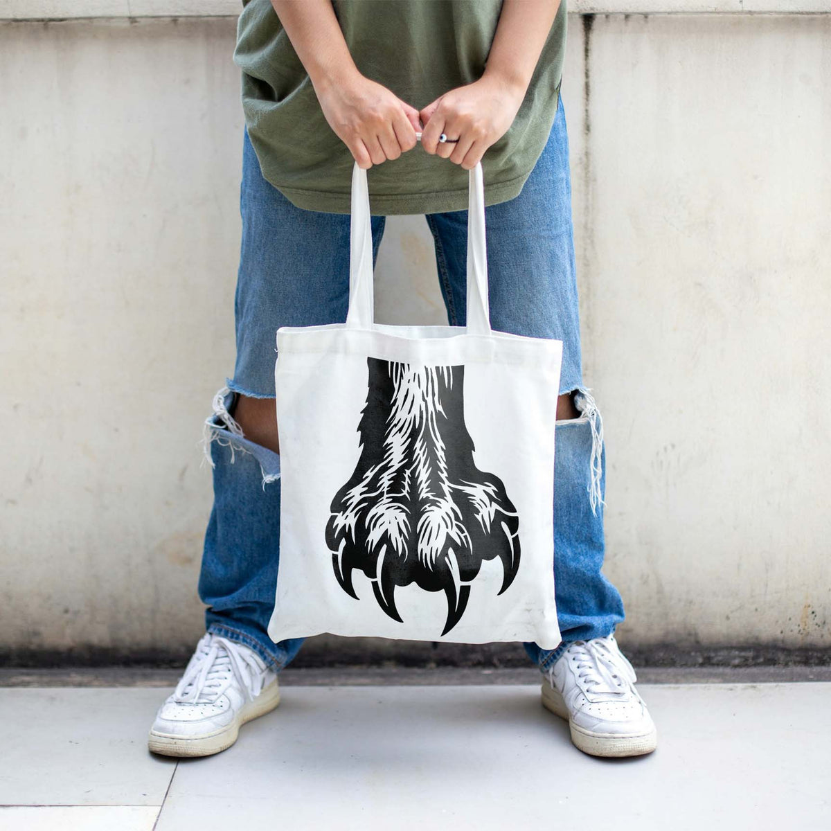 A white tote bag carries the Bear Claw Paw Stencil in a bold black clawed paw graphic