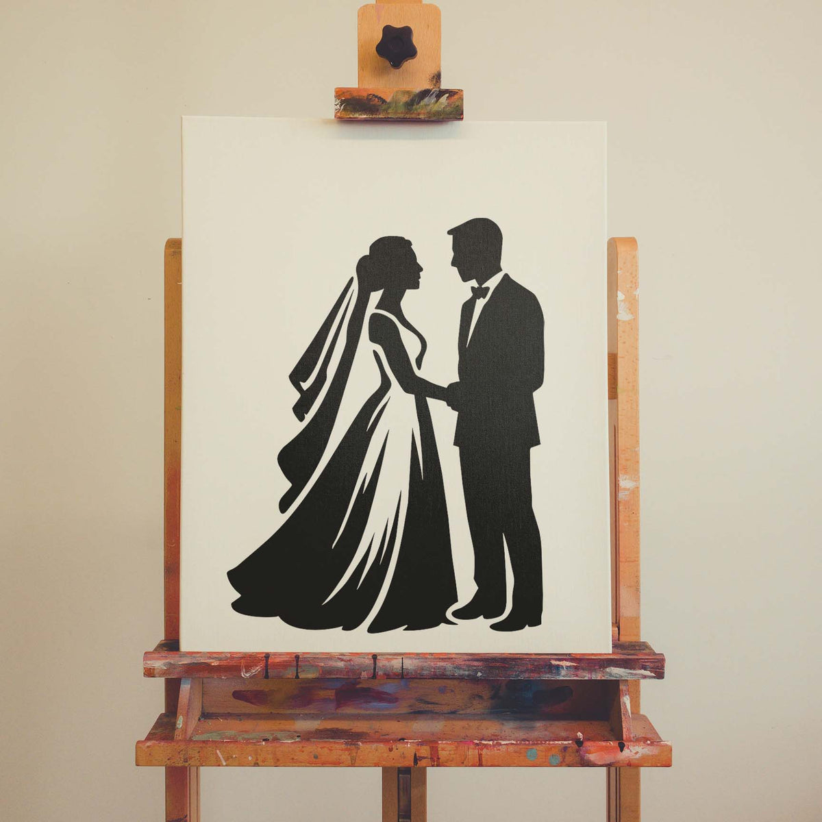 Bride and groom silhouette stencil painted black on a white canvas