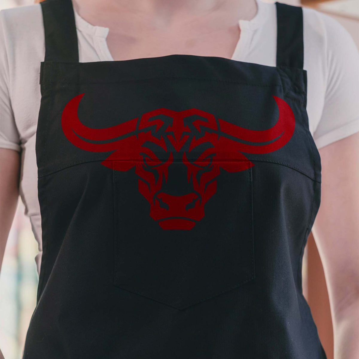 Buffalo Head Stencil with bold longhorn design printed in red across a black apron.