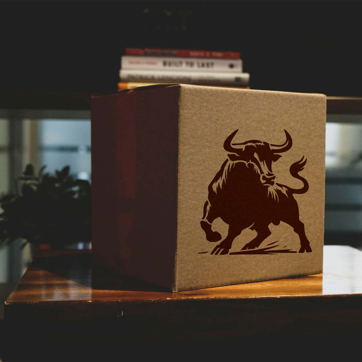 Charging Bull Stencil painted on a cardboard box with a bold horned bull design