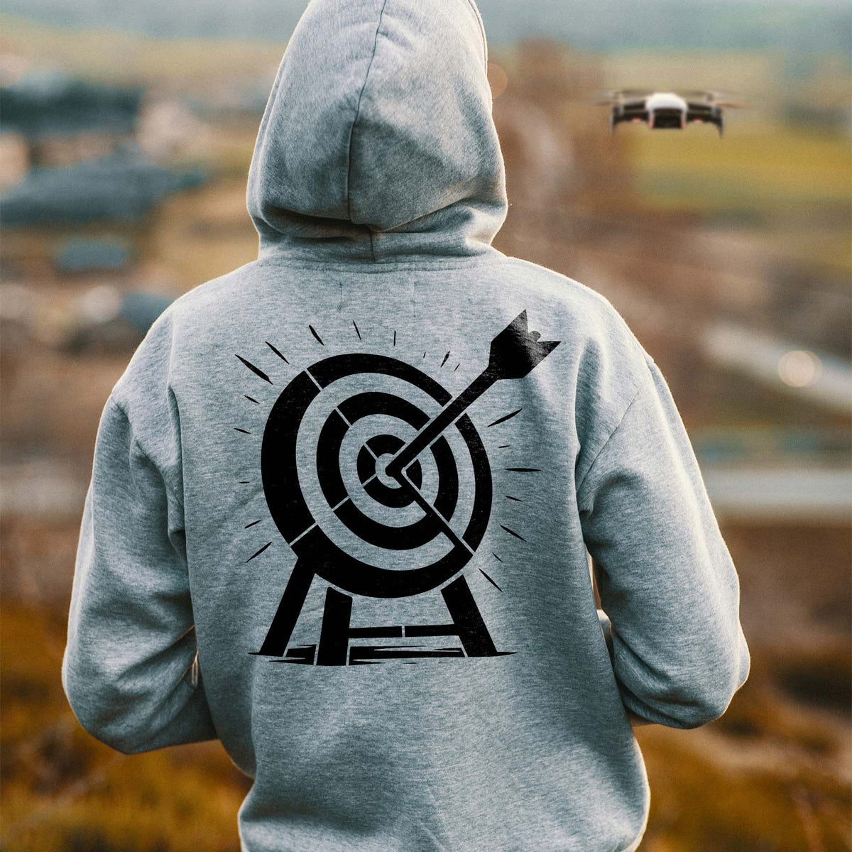 Bullseye Target with Arrow Stencil printed in black across the back of a gray hoodie