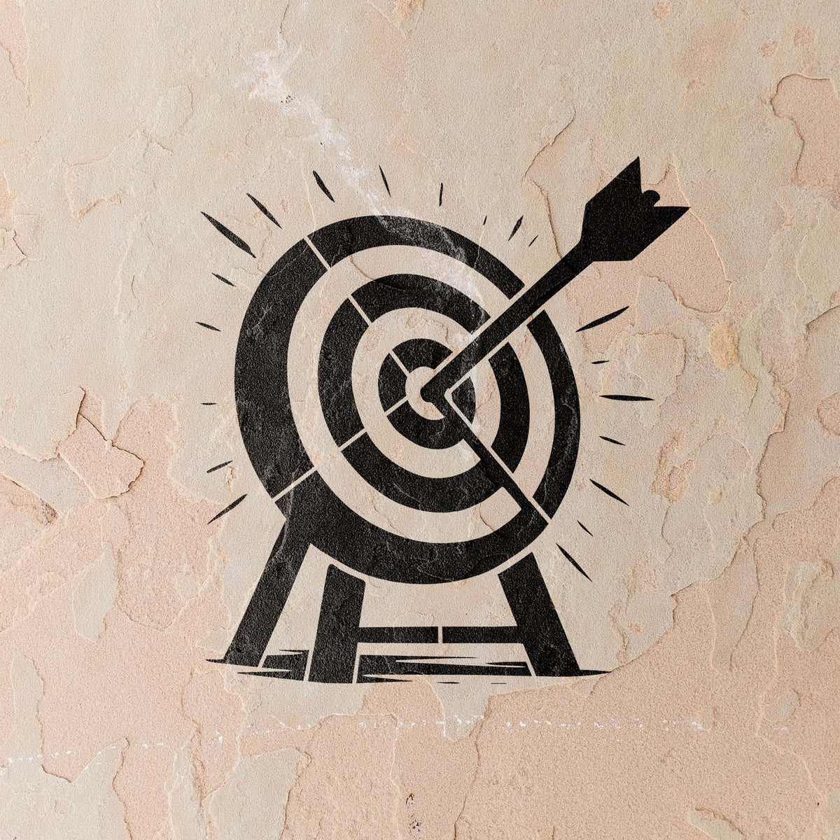 Weathered plaster wall displays the Bullseye Target with Arrow Stencil in bold black
