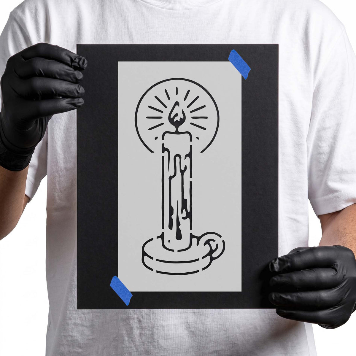 Candle stencil with dripping wax, glowing flame and radiating light lines