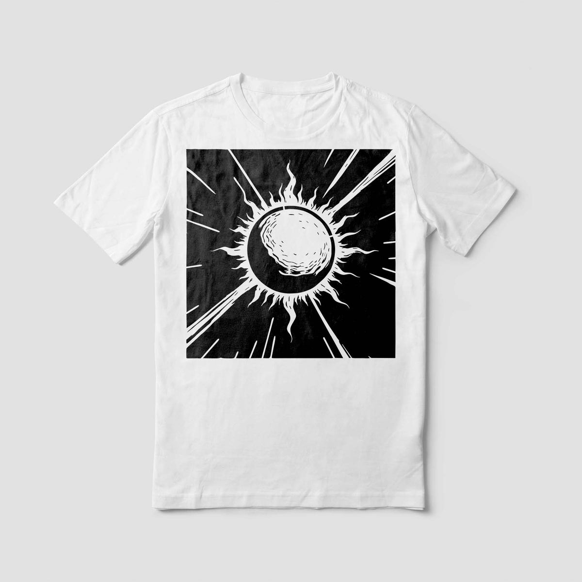 A white T-shirt showcases the Celestial Sunburst Eclipse Stencil with a bold black cosmic design.
