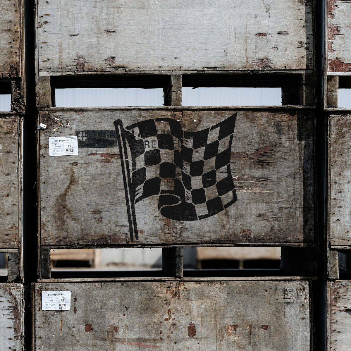 On weathered crates, Checkered Racing Flag Stencil shows a bold black race flag.