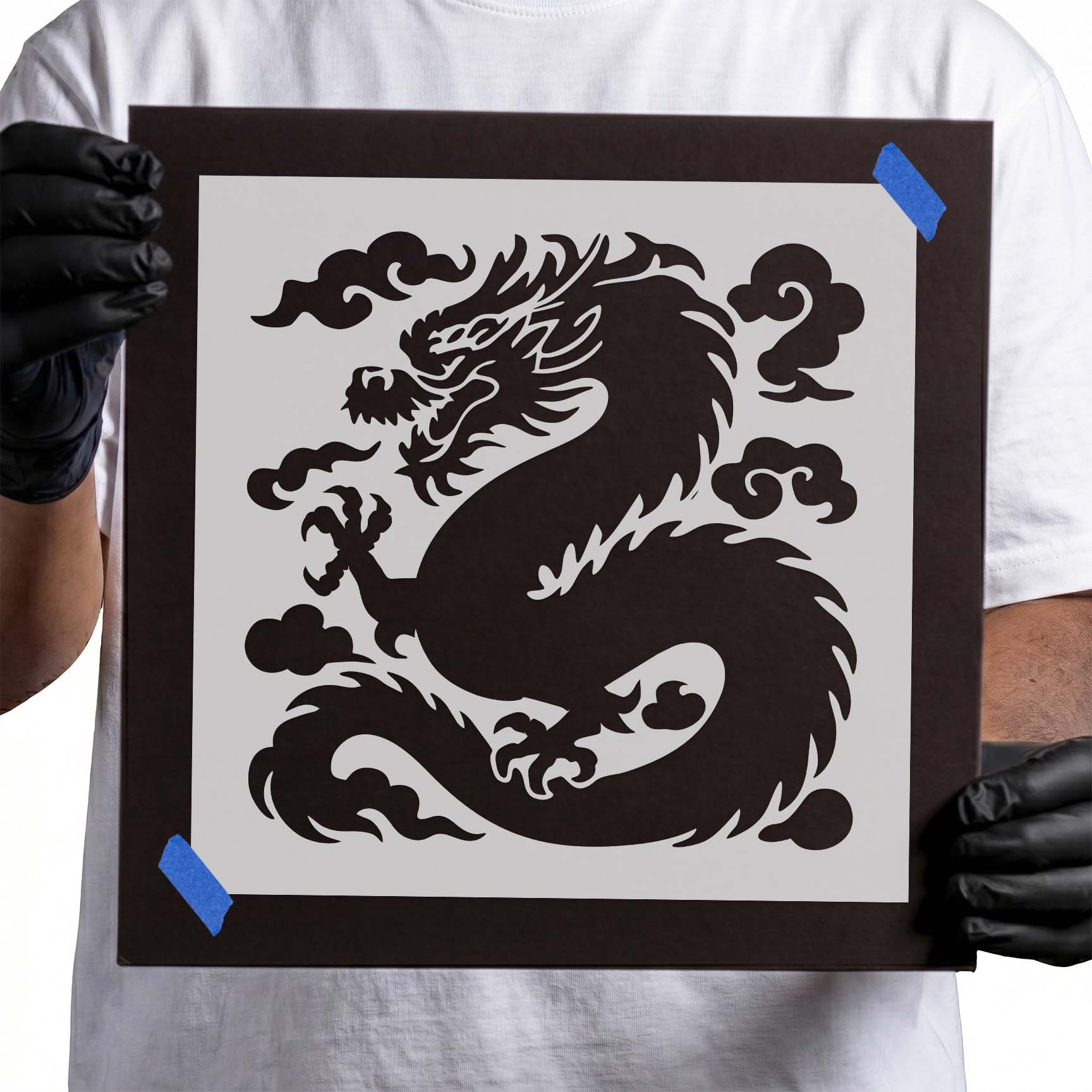 Chinese dragon stencil with long curled body, claws, and swirling clouds

