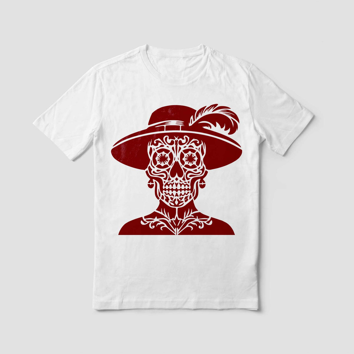A white shirt showcases the Classic Catrina Sugar Skull Stencil with its feathered hat detail.