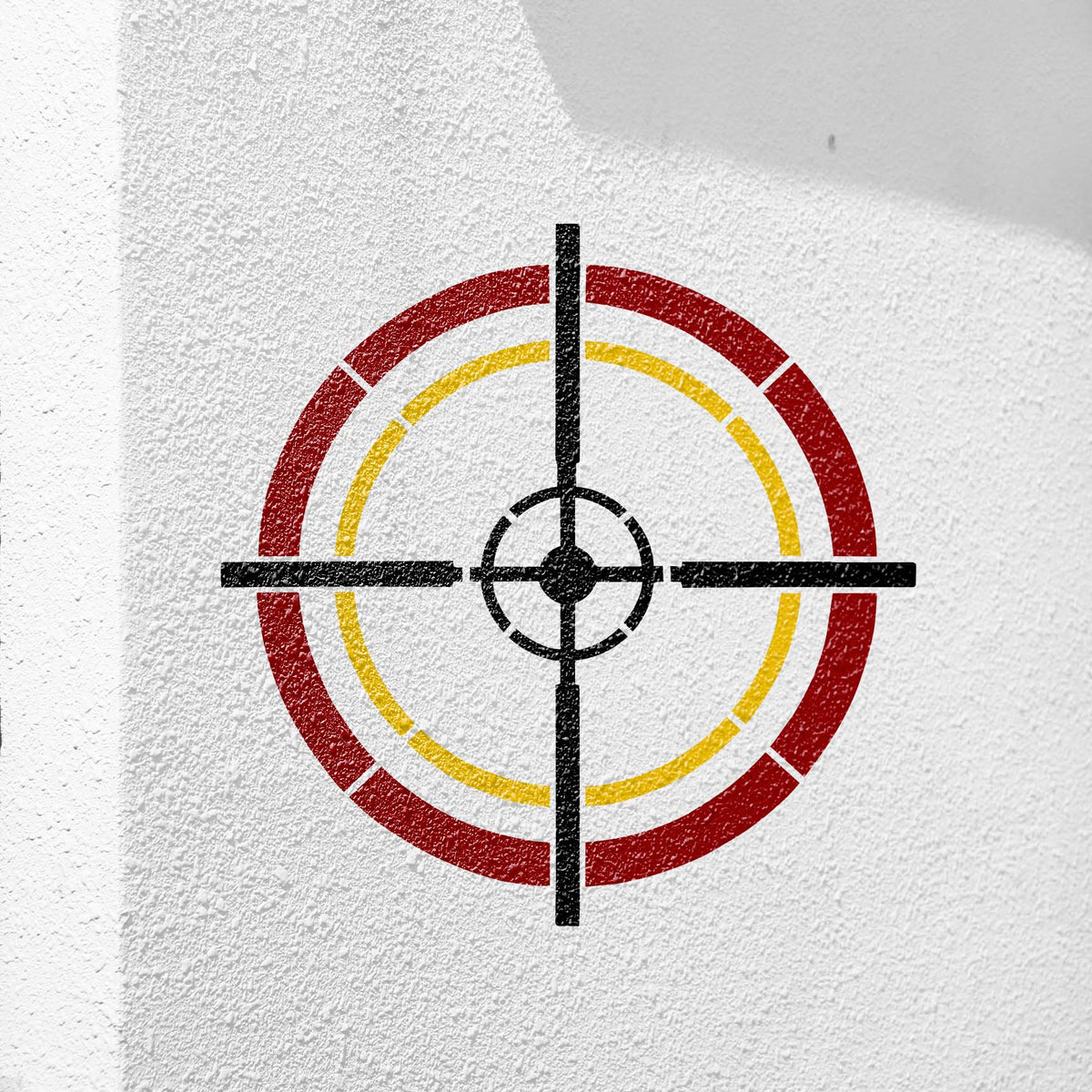 On a textured white wall, Tactical Crosshair Reticle Stencil shows a bold multicolor sight design