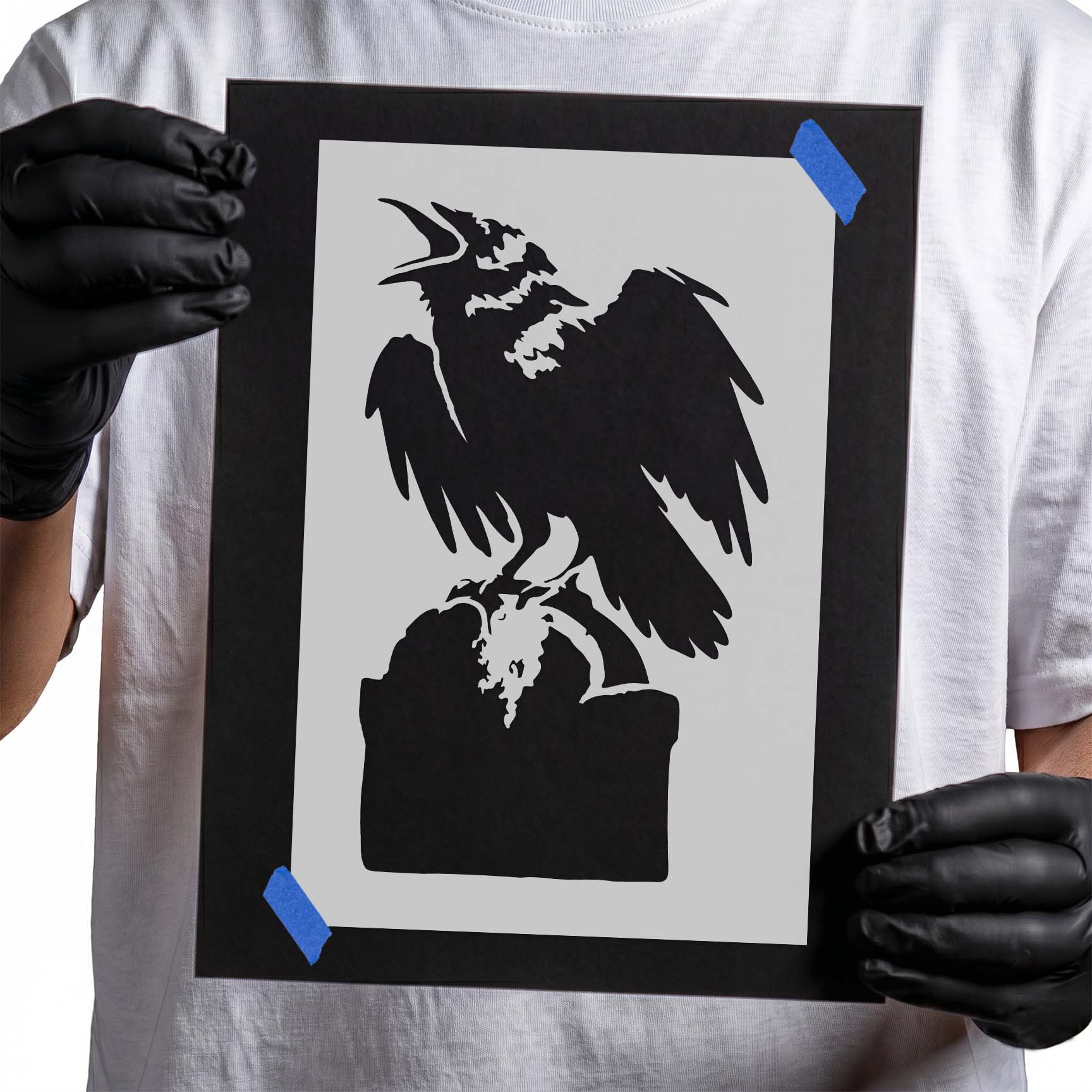 Crow stencil perched on a weathered tombstone with spread wings for Halloween and Gothic craft projects