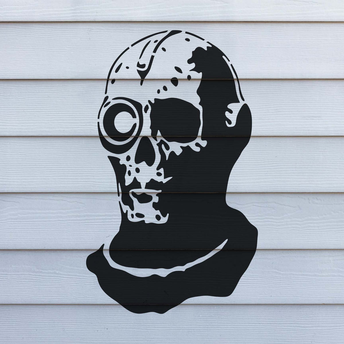 Cyborg Skull Stencil stands out in black across clean white horizontal wall siding.