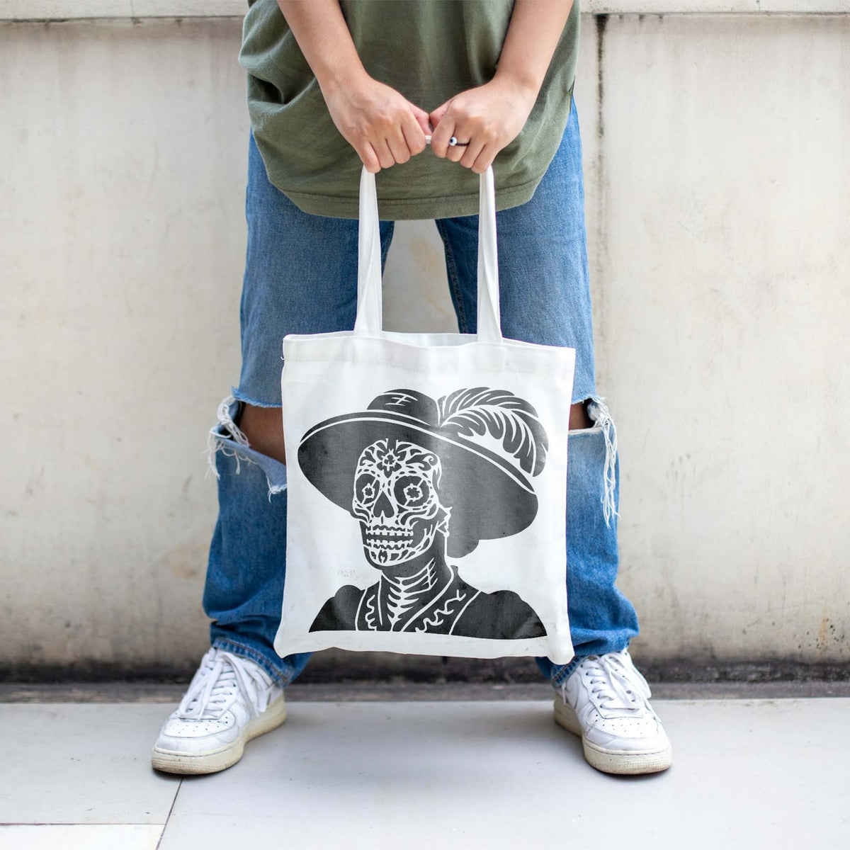A white tote bag features the Day of the Dead Lady Portrait Stencil with its ornate sugar skull design