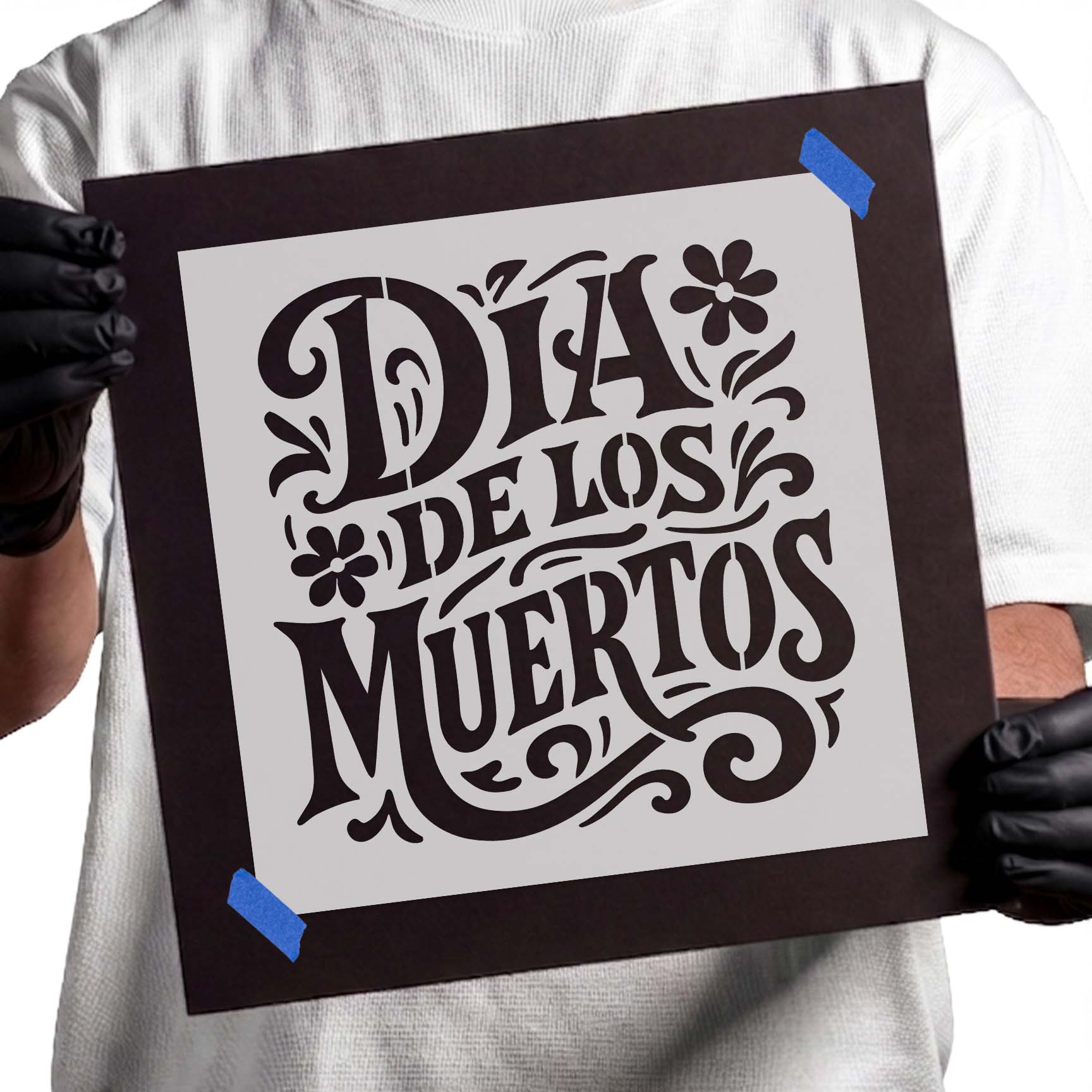 Día de los Muertos lettering stencil with decorative floral accents
