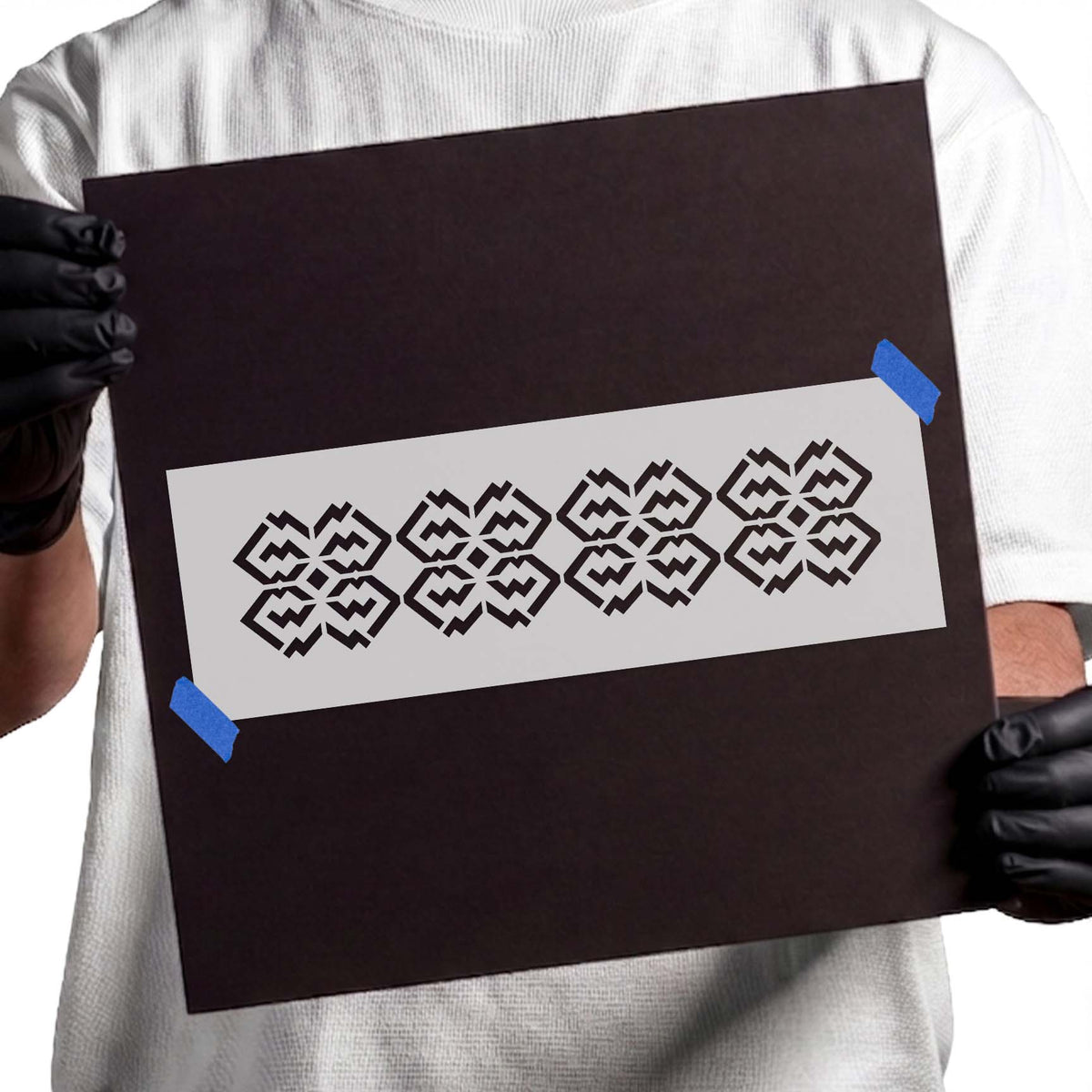 Diamond swirl pattern stencil featuring four repeating geometric motifs with angular zigzag details