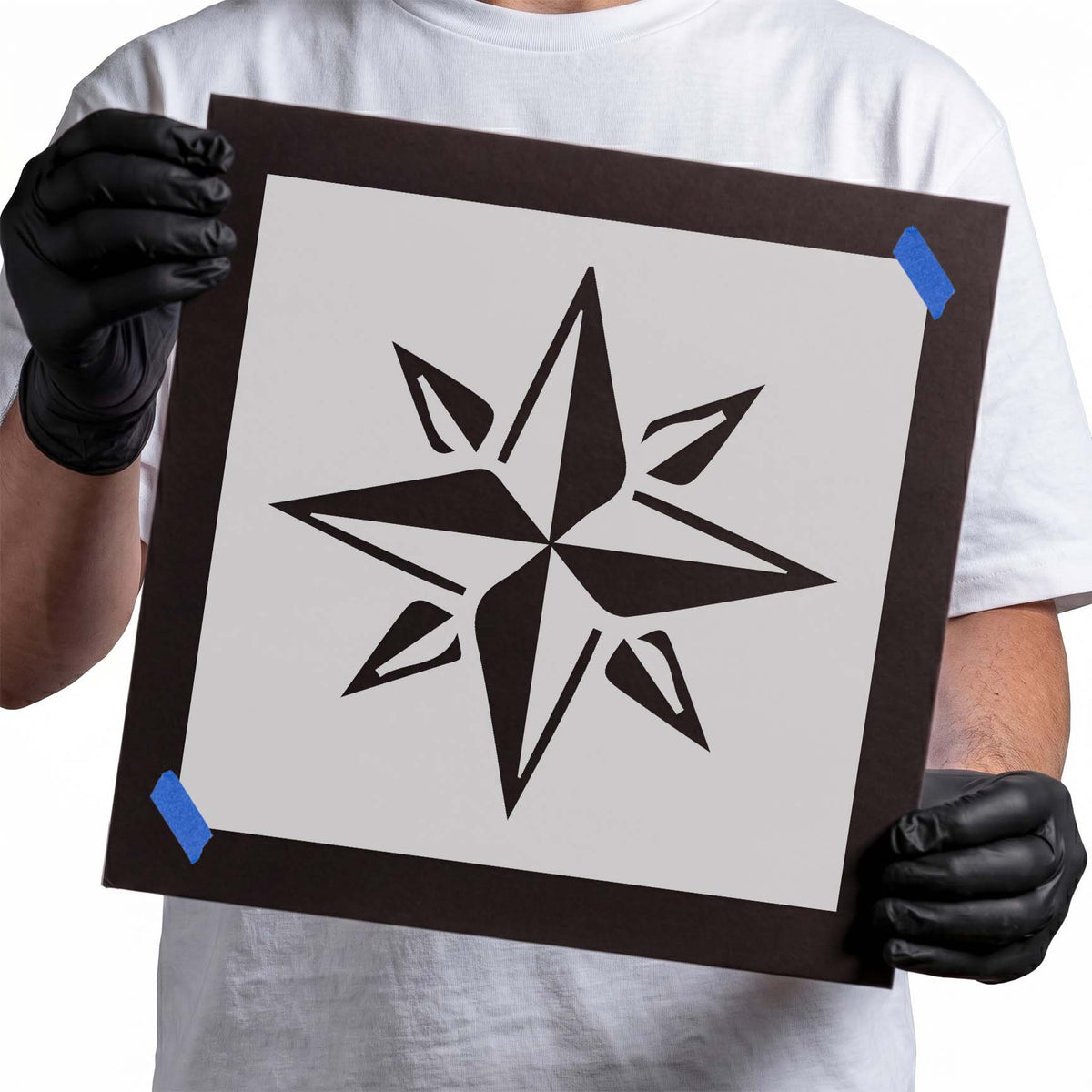 Eight-point compass star stencil with elongated directional points and angular geometric details