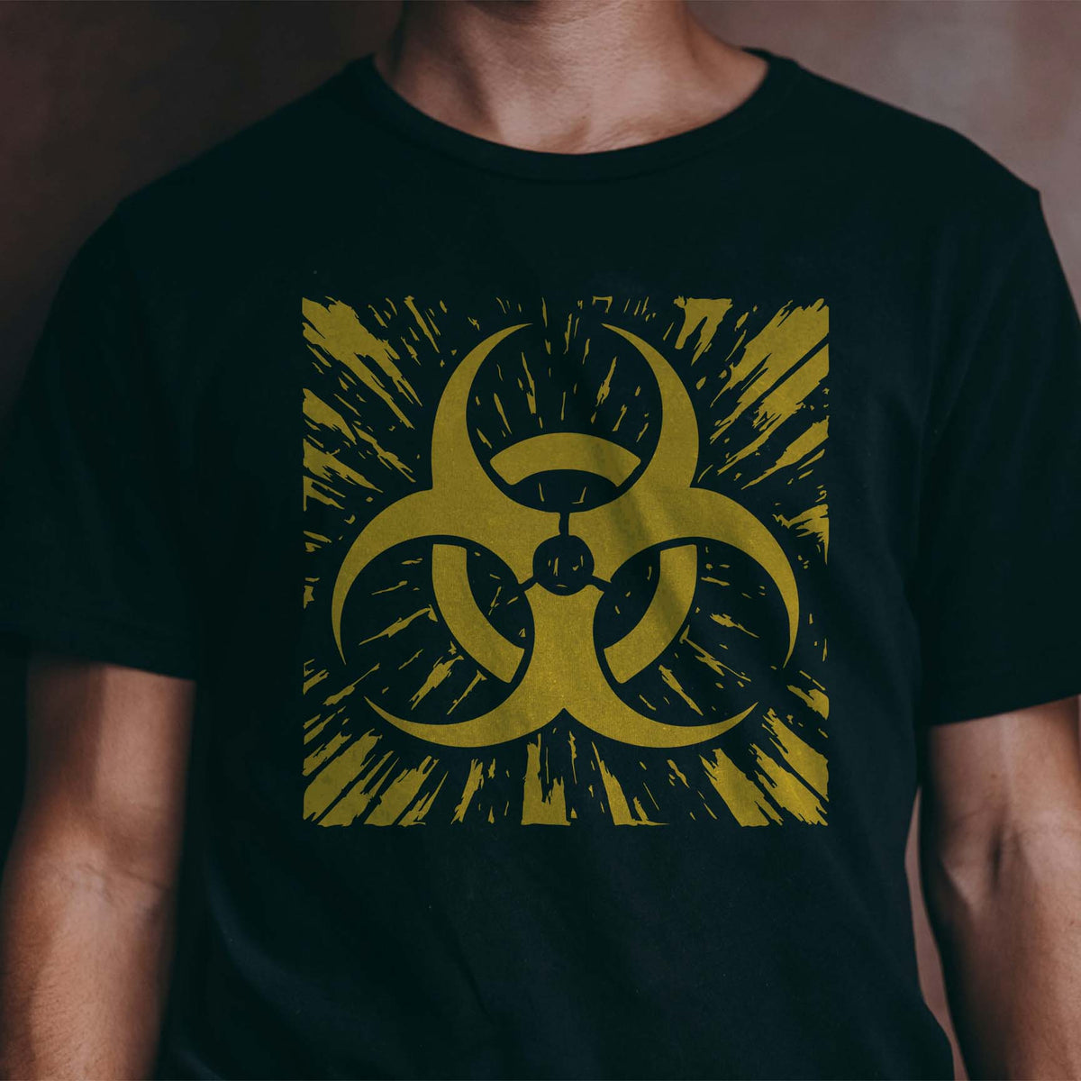 Distressed Biohazard Symbol Stencil makes a rugged yellow hazard graphic stand out on a black T-shirt.