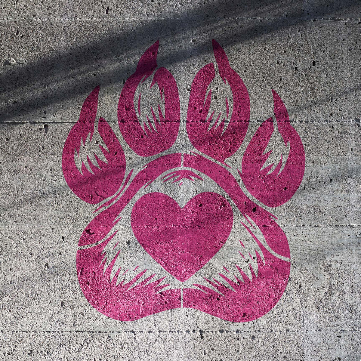 Bright pink Dog Paw Print Heart Stencil makes a loving paw motif pop against rough concrete