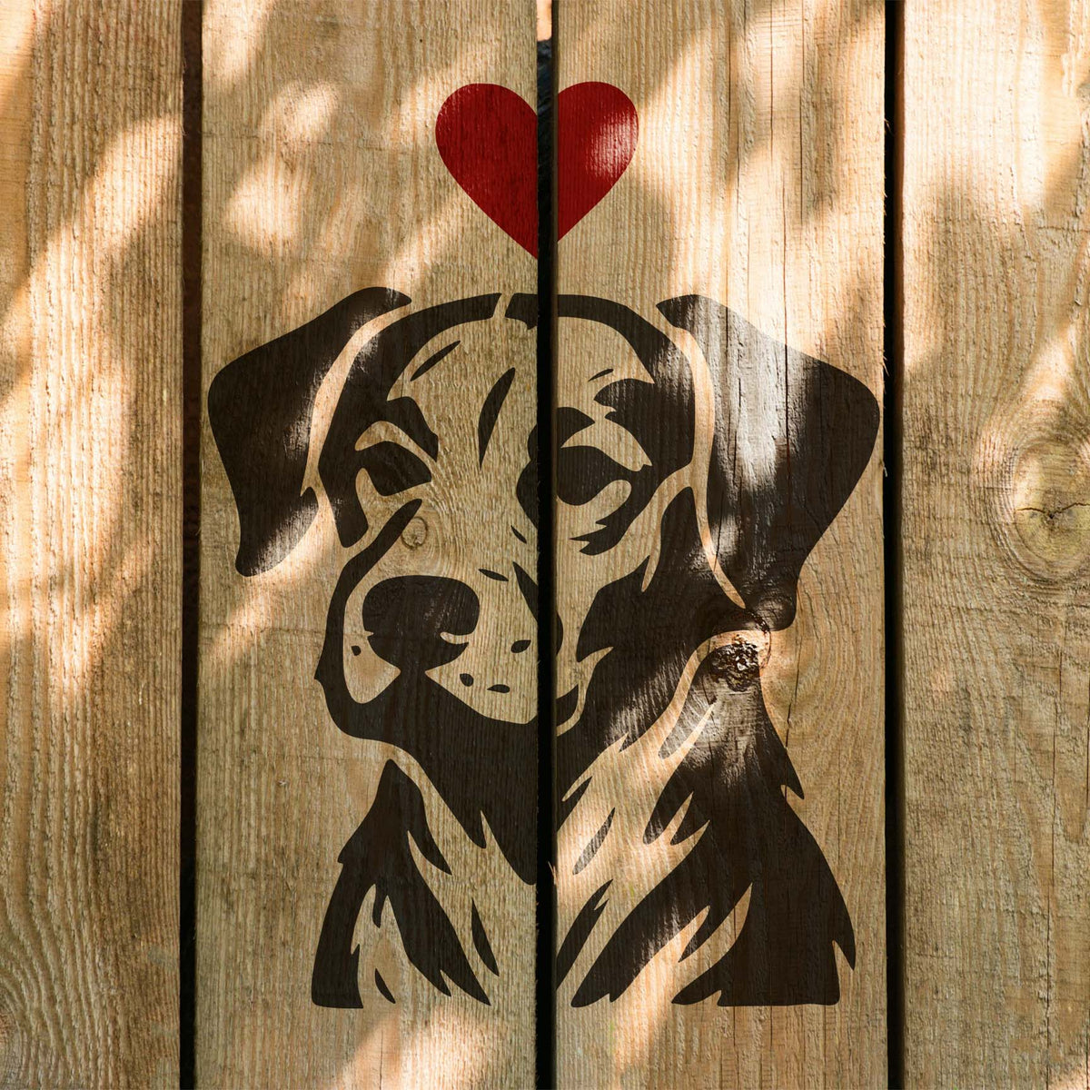 Dog Portrait with Heart Stencil displayed on a sunlit wooden fence with a red heart above.