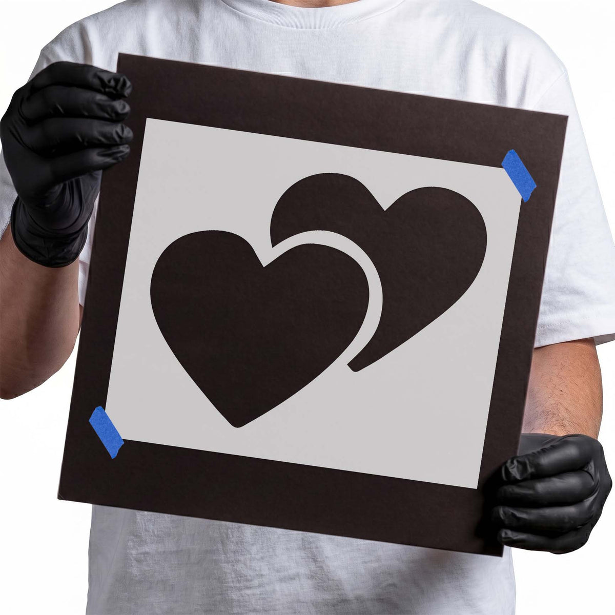 Double Hearts Stencil featuring two overlapping black hearts with a curved separation