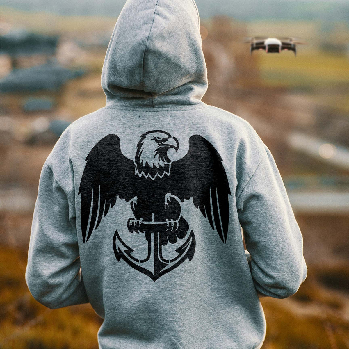 Across a gray hoodie's back, the Eagle and Anchor Emblem Stencil displays wide wings and a detailed anchor.