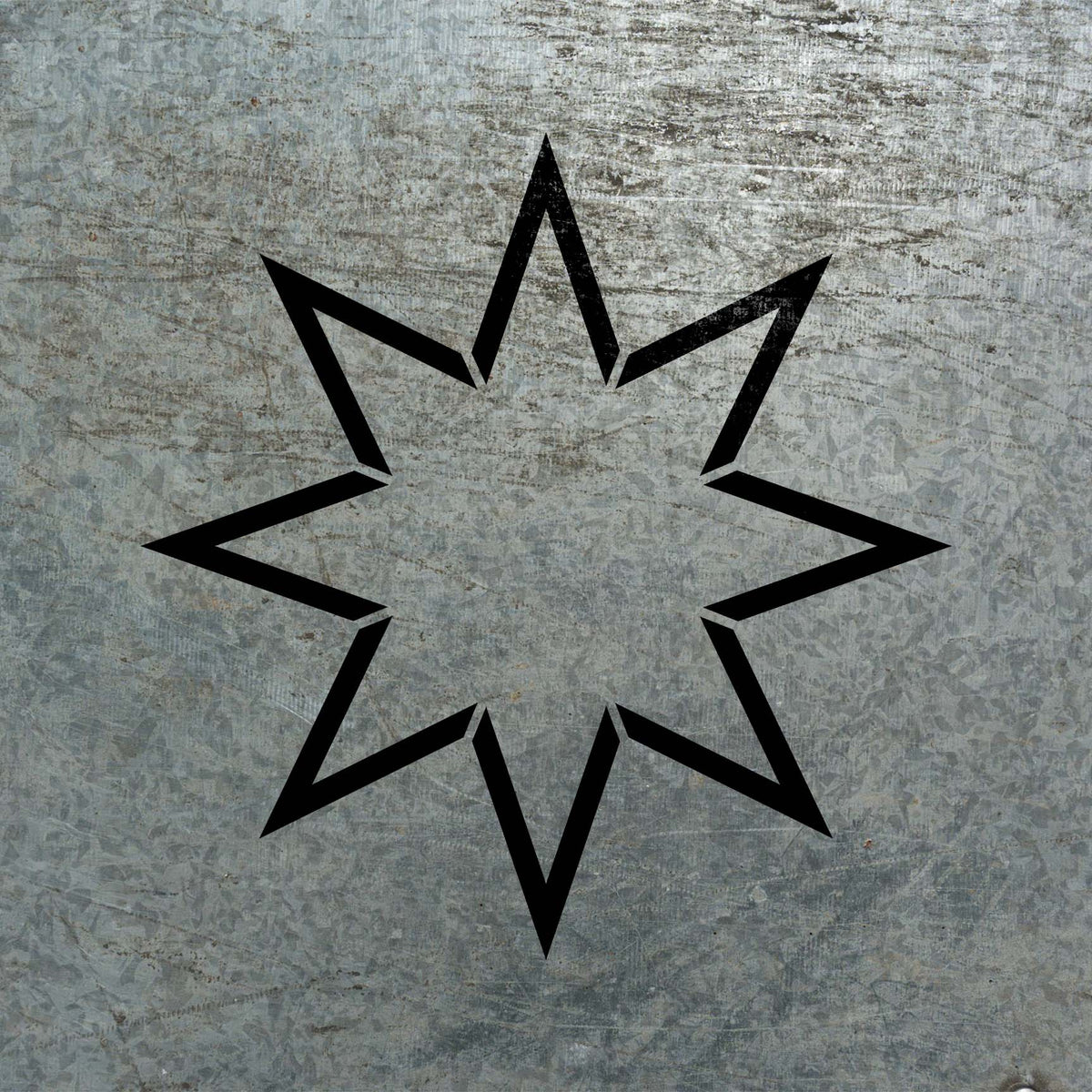 Bold Eight-Point Star Outline Stencil stands out against a weathered metal surface