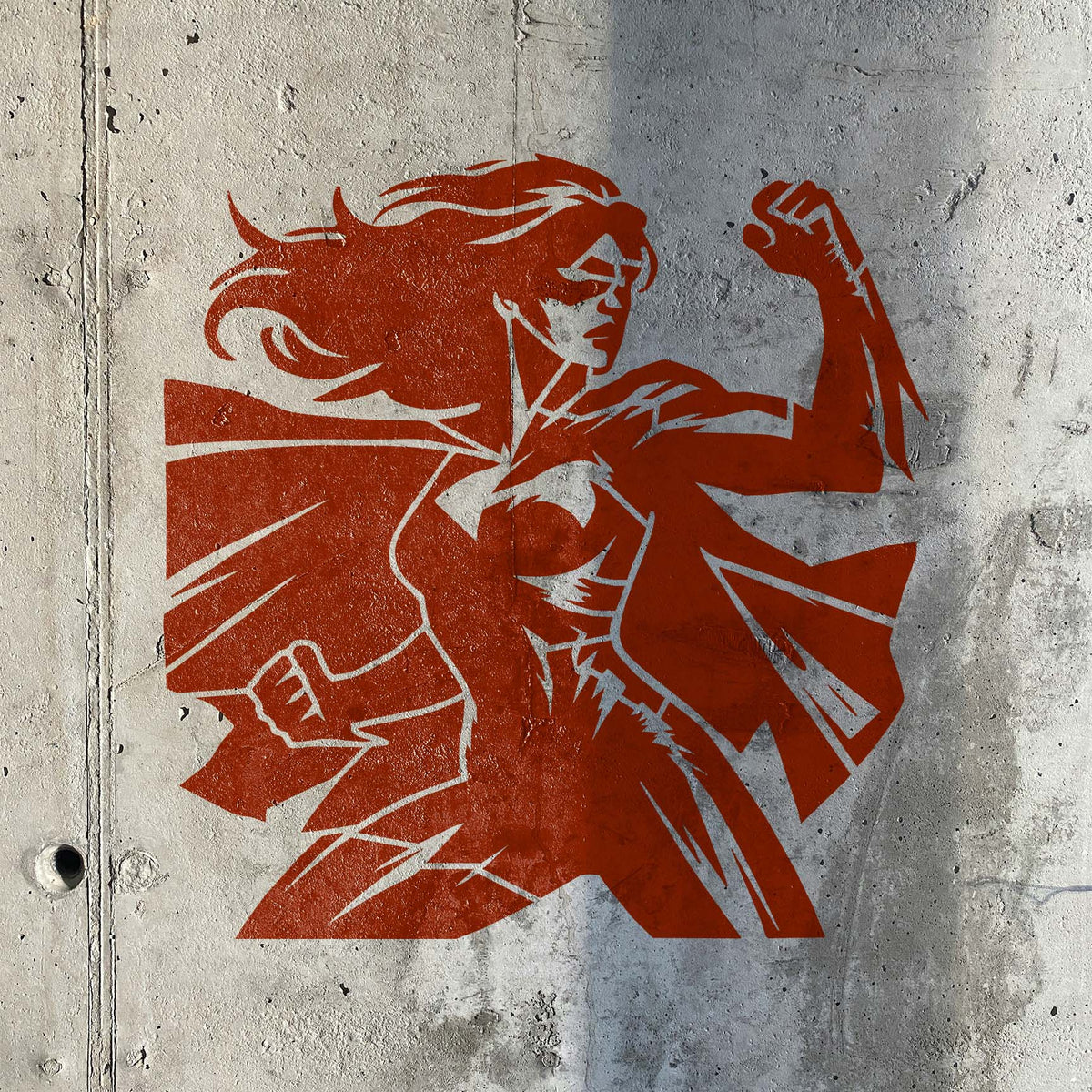 Empowered Female Superhero Stencil shows a caped heroine flexing her arm on concrete