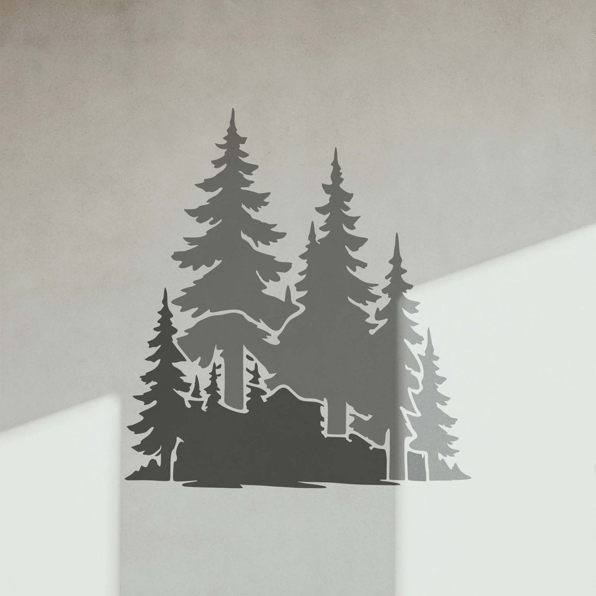 Evergreen Woodland Trees stencil casts a striking forest scene on a sunlit wall
