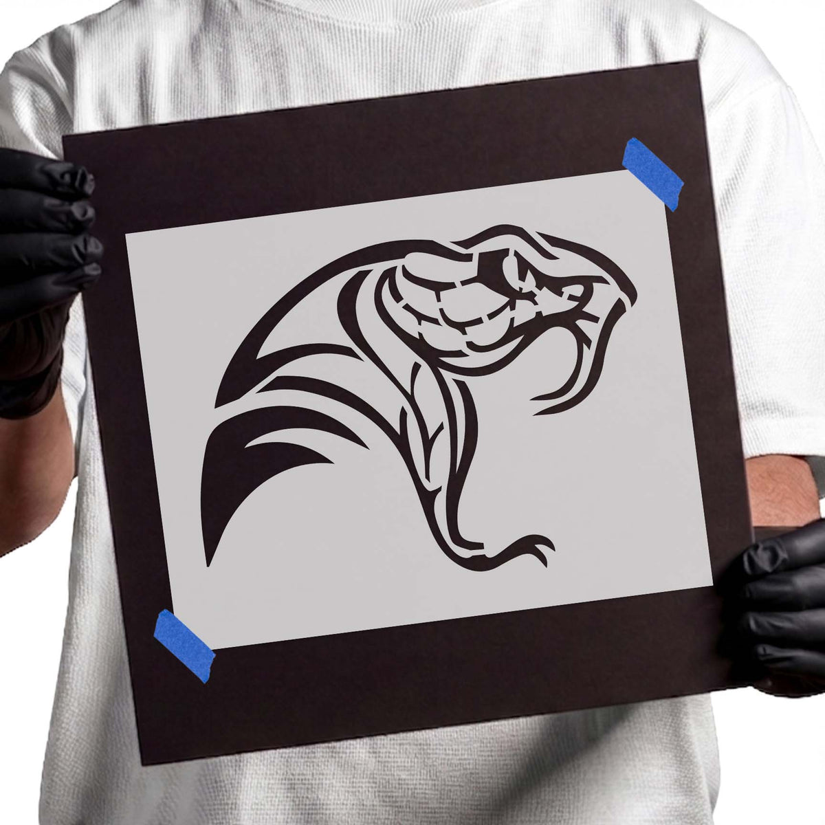 Fanged viper stencil featuring an aggressive snake head with curved fangs and tribal details