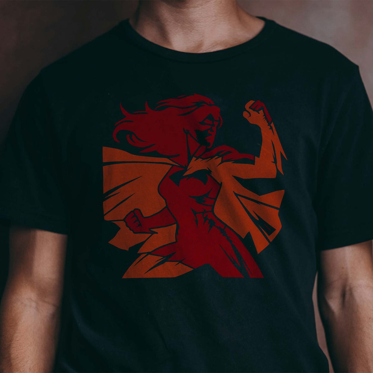 Bold Empowered Female Superhero Stencil strikes a powerful pose across a black T-shirt