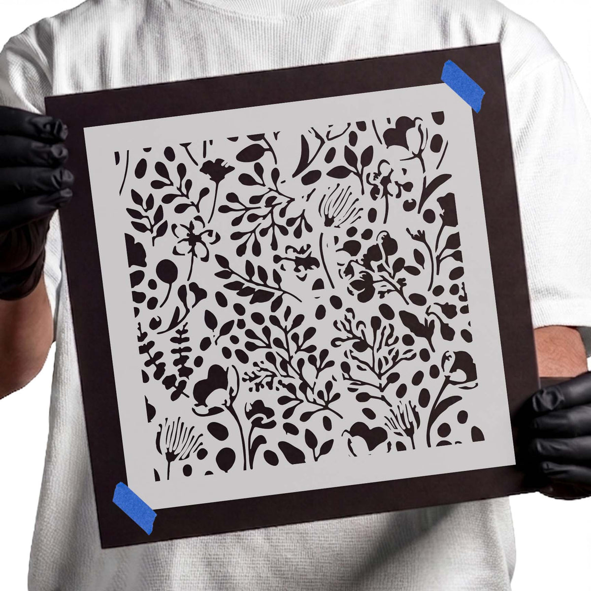 Floral pattern stencil featuring delicate blossoms, leafy branches, and scattered botanical details