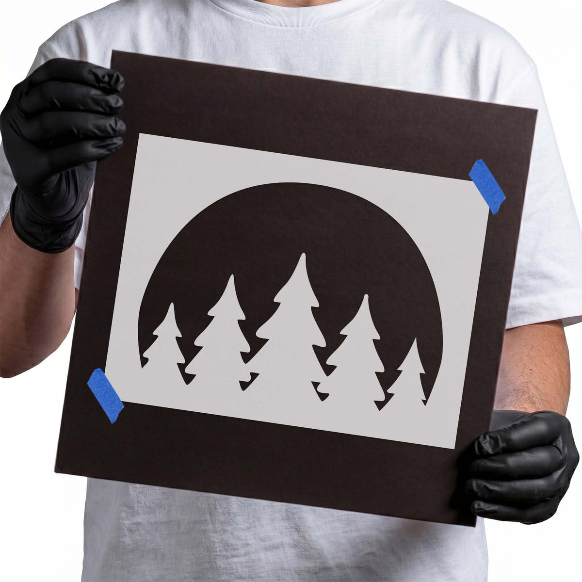 Forest Circle Stencil featuring five pine tree silhouettes against a bold semicircular backdrop