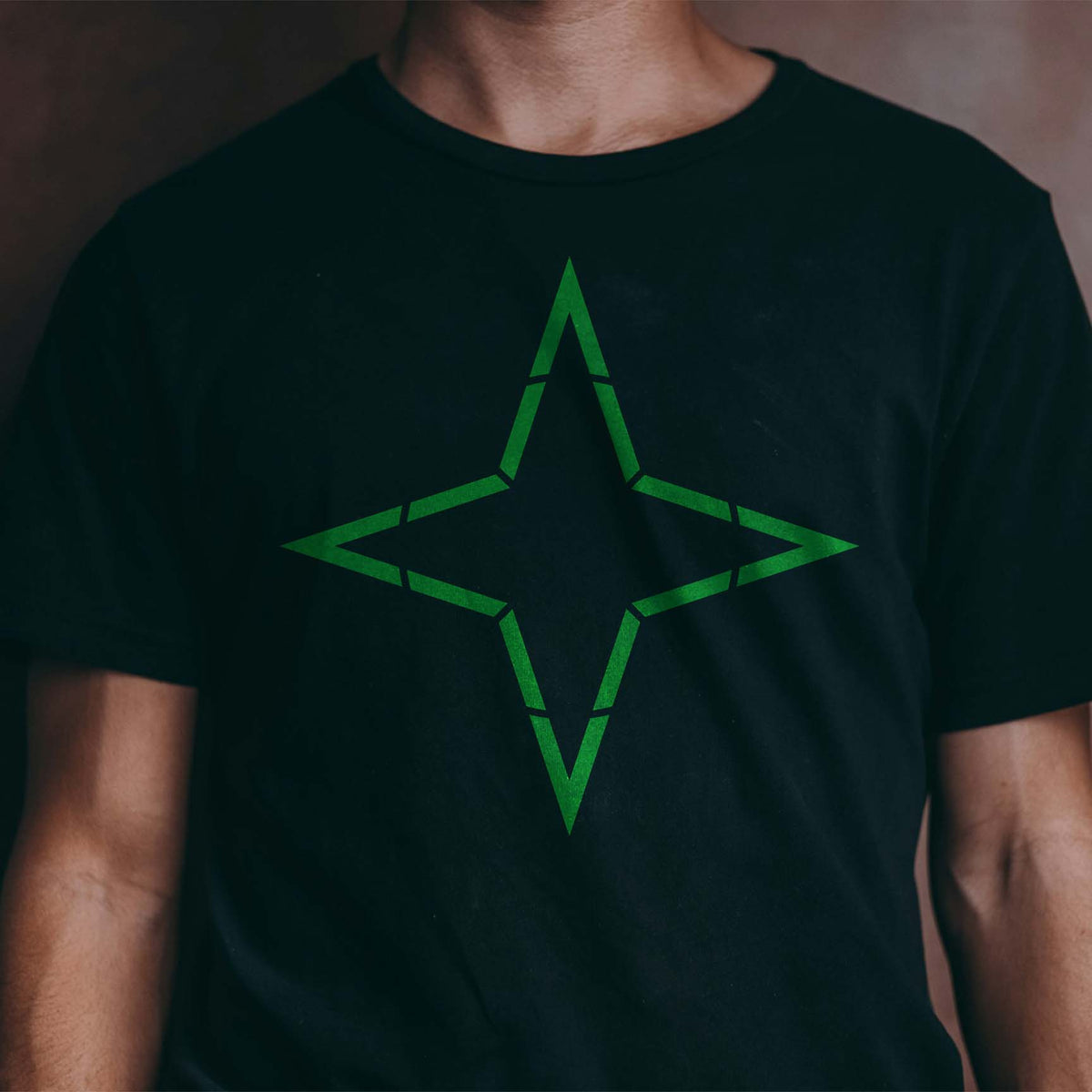 Green Four Point Star Outline Stencil makes a sharp geometric statement on a black T-shirt