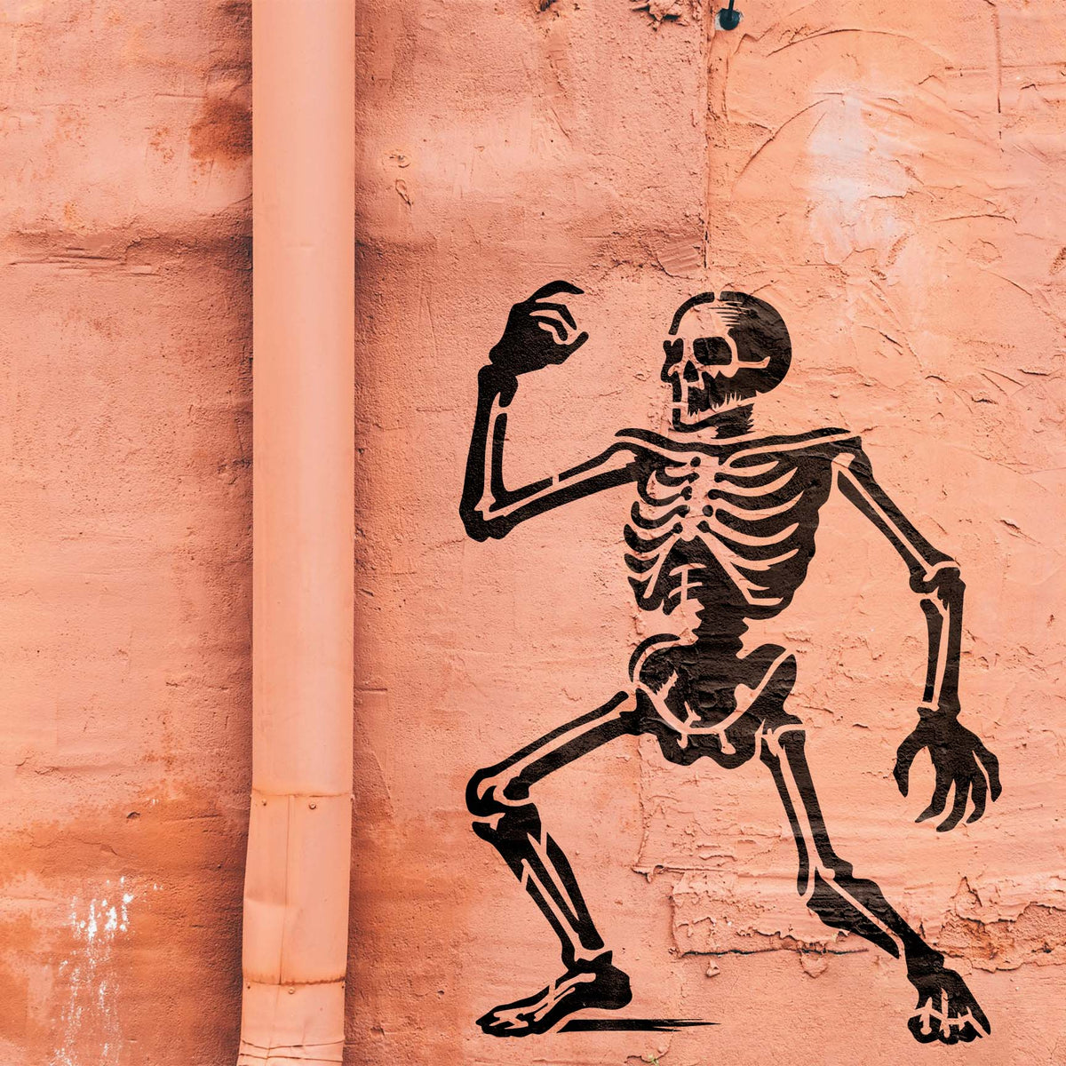 Playful Animated Dancing Skeleton Stencil appears in black across a textured salmon wall