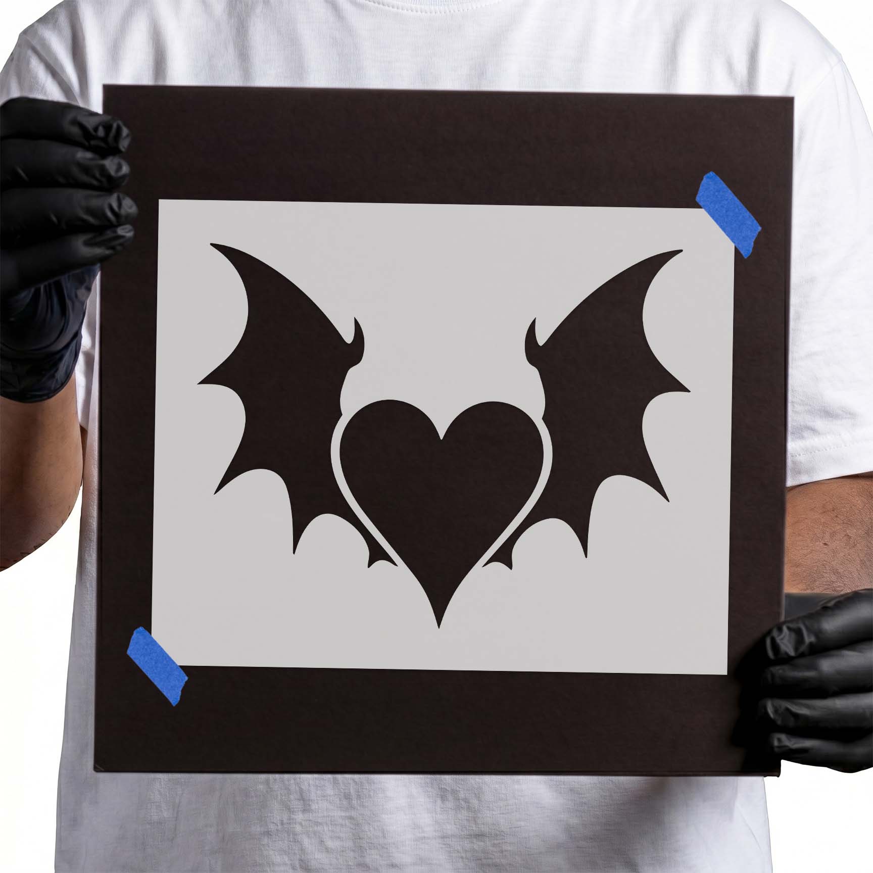 Gothic Heart with Wings Stencil featuring a heart framed by bat-inspired wings.