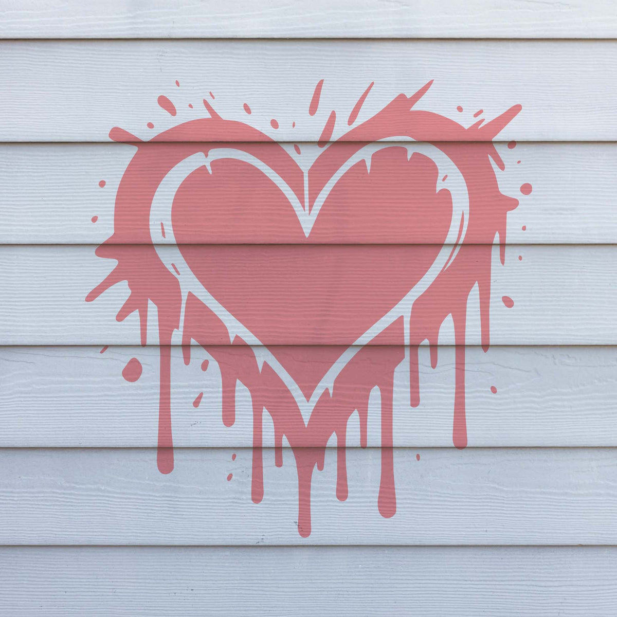 Pink splashes and dripping edges make the Graffiti Heart Drip Stencil pop on white horizontal wall siding.